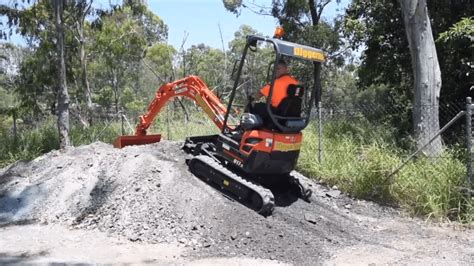 mini excavator climbing|digging a mini mound.